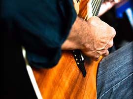 Playing a Koa Ovation Guitar